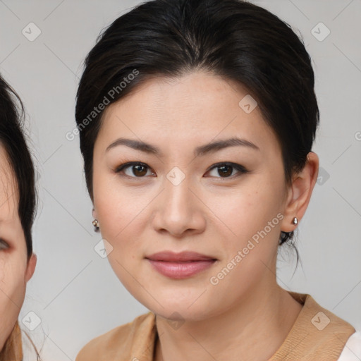 Joyful asian young-adult female with medium  brown hair and brown eyes