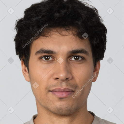 Neutral latino young-adult male with short  brown hair and brown eyes