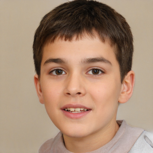 Joyful white child male with short  brown hair and brown eyes