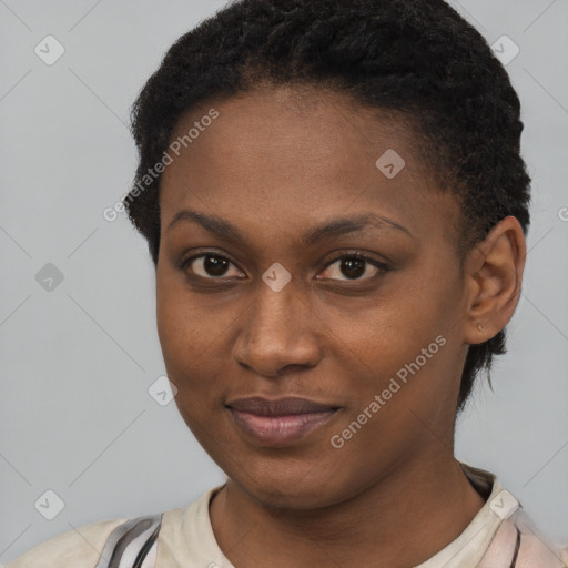 Joyful black young-adult female with short  black hair and brown eyes