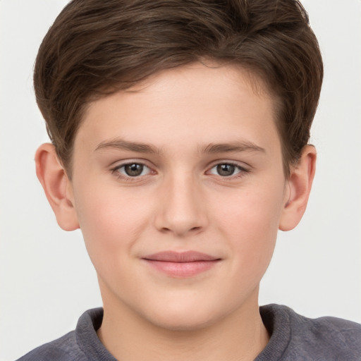 Joyful white child male with short  brown hair and grey eyes