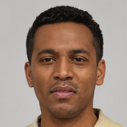 Neutral black young-adult male with short  black hair and brown eyes