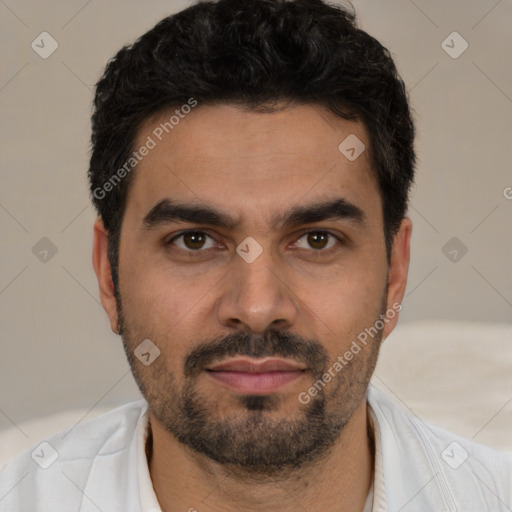 Joyful white young-adult male with short  black hair and brown eyes