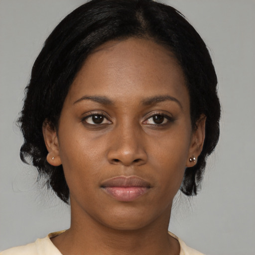Neutral black young-adult female with medium  black hair and brown eyes