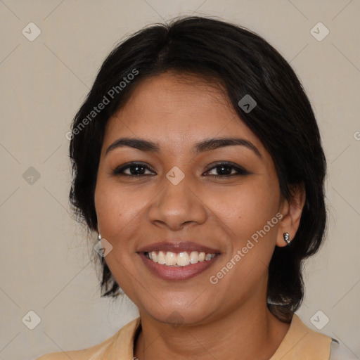 Joyful latino young-adult female with medium  brown hair and brown eyes