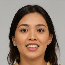 Joyful asian young-adult female with long  brown hair and brown eyes