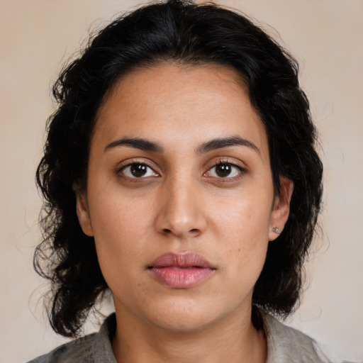 Neutral latino young-adult female with medium  brown hair and brown eyes