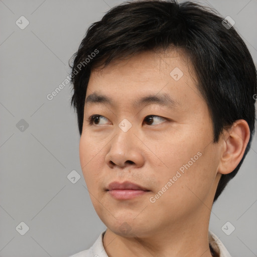 Neutral asian young-adult male with short  black hair and brown eyes