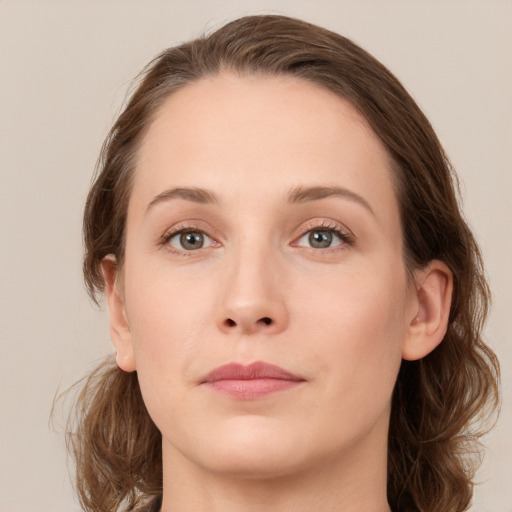 Neutral white young-adult female with medium  brown hair and green eyes