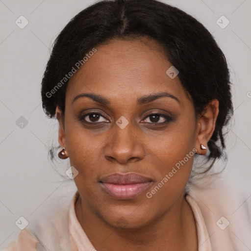 Joyful black adult female with medium  brown hair and brown eyes