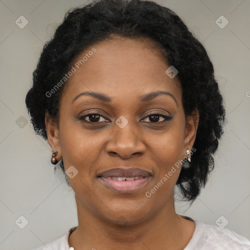 Joyful black adult female with short  brown hair and brown eyes