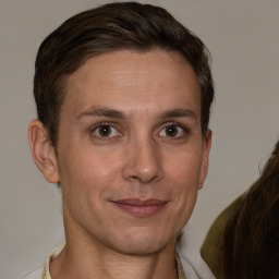 Joyful white adult female with short  brown hair and brown eyes