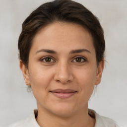 Joyful white adult female with short  brown hair and brown eyes