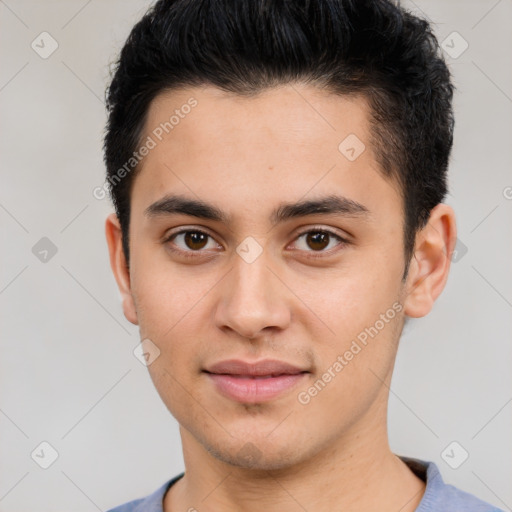 Joyful white young-adult male with short  black hair and brown eyes