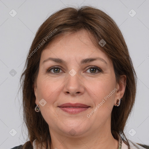 Joyful white adult female with medium  brown hair and grey eyes