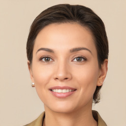 Joyful white young-adult female with medium  brown hair and brown eyes