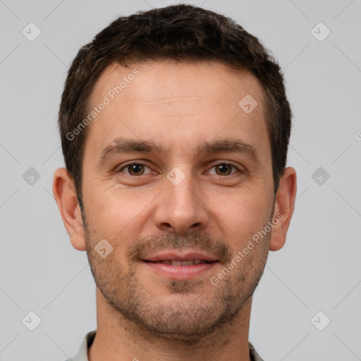 Joyful white young-adult male with short  brown hair and brown eyes