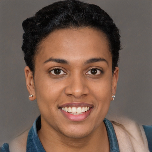 Joyful latino young-adult female with short  brown hair and brown eyes