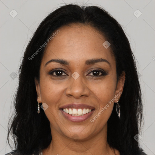 Joyful black young-adult female with long  brown hair and brown eyes