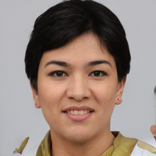 Joyful asian young-adult female with medium  black hair and brown eyes