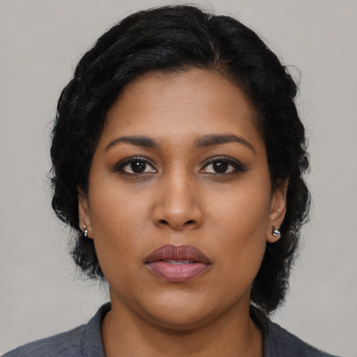 Neutral black young-adult female with medium  black hair and brown eyes