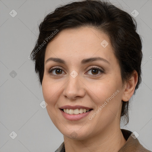 Joyful white adult female with medium  brown hair and brown eyes