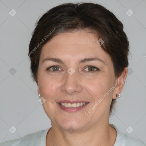 Joyful white adult female with short  brown hair and brown eyes