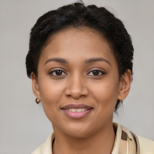Joyful latino young-adult female with short  brown hair and brown eyes