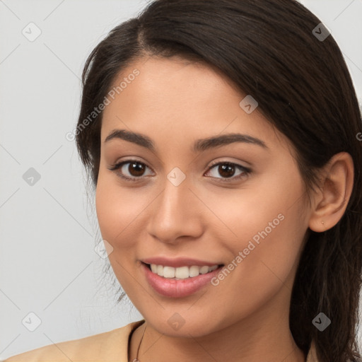 Joyful white young-adult female with long  brown hair and brown eyes