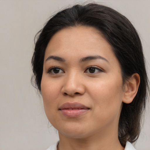 Joyful asian young-adult female with medium  brown hair and brown eyes