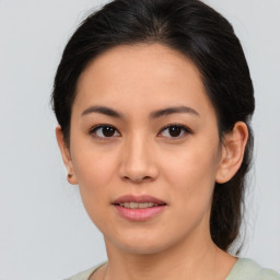 Joyful asian young-adult female with medium  brown hair and brown eyes