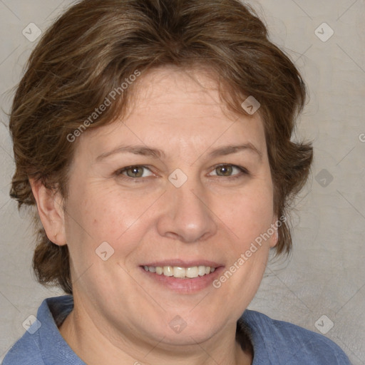 Joyful white adult female with medium  brown hair and blue eyes