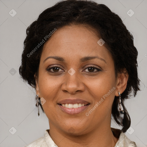 Joyful black adult female with medium  brown hair and brown eyes