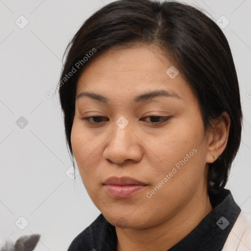 Joyful white adult female with medium  brown hair and brown eyes