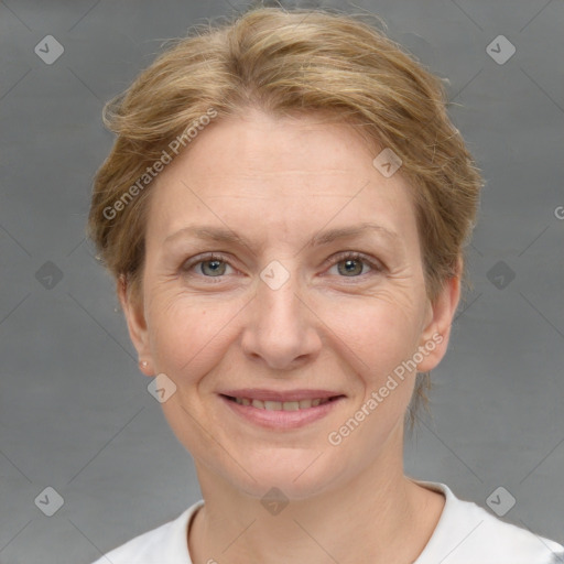 Joyful white adult female with short  brown hair and grey eyes