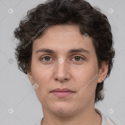 Joyful white adult female with short  brown hair and brown eyes