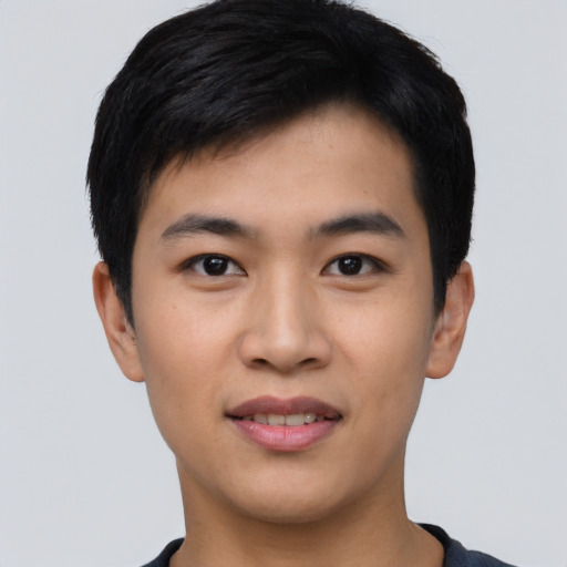 Joyful asian young-adult male with short  black hair and brown eyes