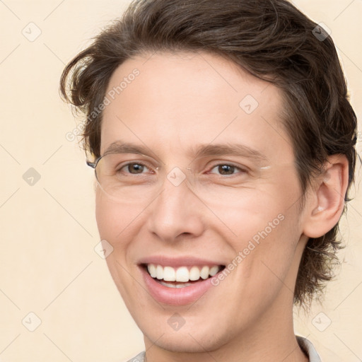 Joyful white young-adult male with medium  brown hair and brown eyes