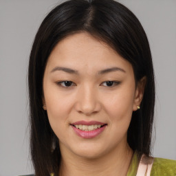 Joyful asian young-adult female with medium  brown hair and brown eyes