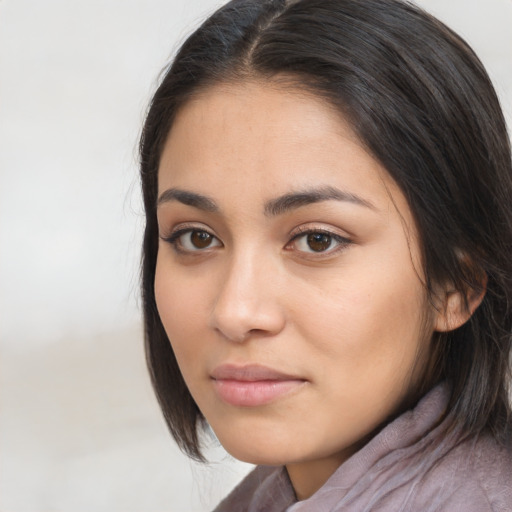 Neutral latino young-adult female with medium  brown hair and brown eyes