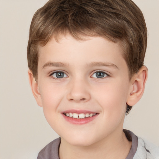 Joyful white child male with short  brown hair and brown eyes