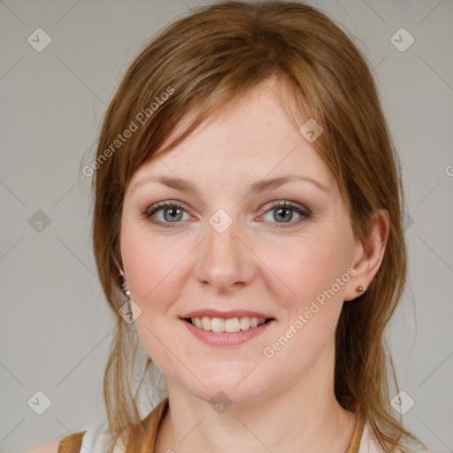 Joyful white young-adult female with medium  brown hair and blue eyes