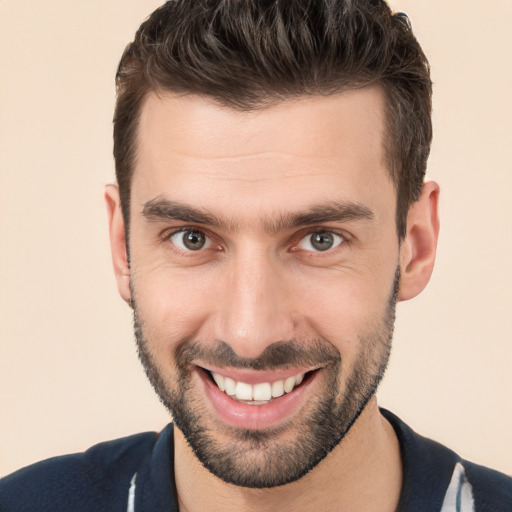 Joyful white young-adult male with short  brown hair and brown eyes