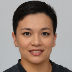 Joyful asian young-adult female with short  black hair and brown eyes