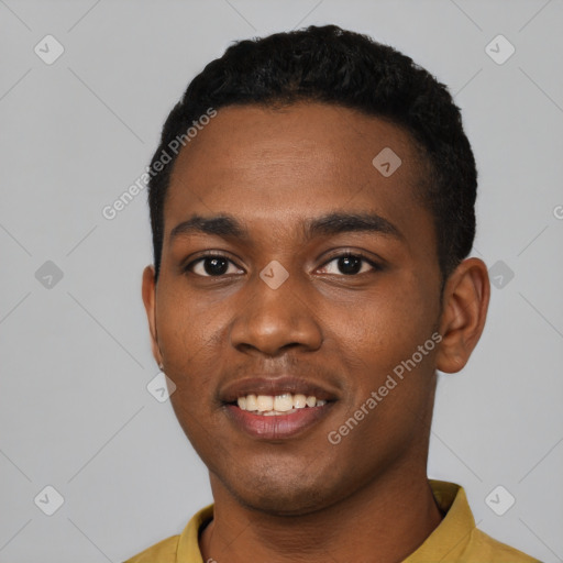 Joyful black young-adult male with short  black hair and brown eyes