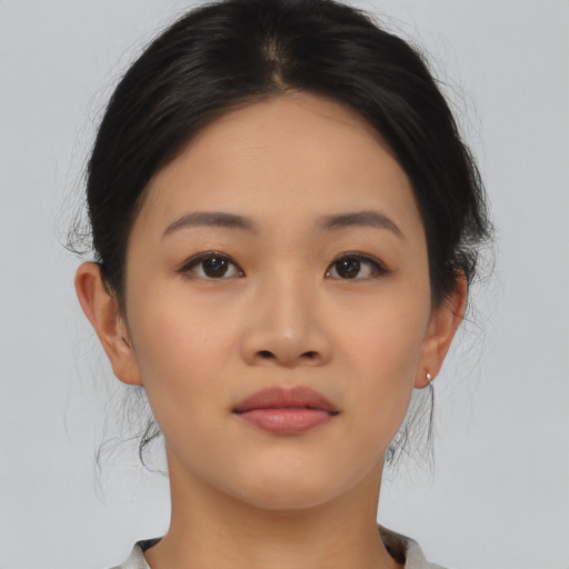 Neutral asian young-adult female with medium  brown hair and brown eyes