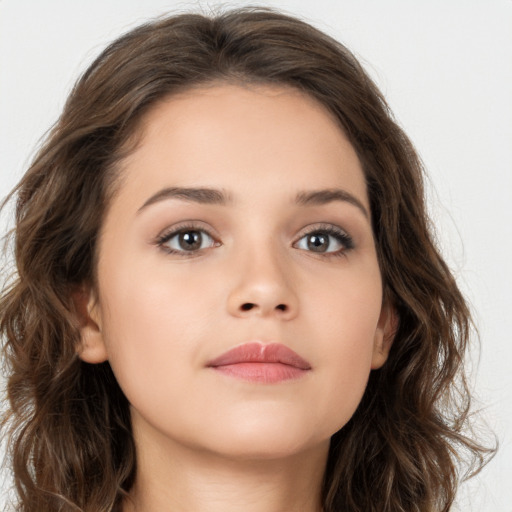 Neutral white young-adult female with long  brown hair and brown eyes