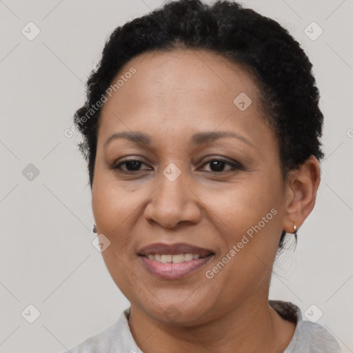 Joyful black adult female with short  brown hair and brown eyes