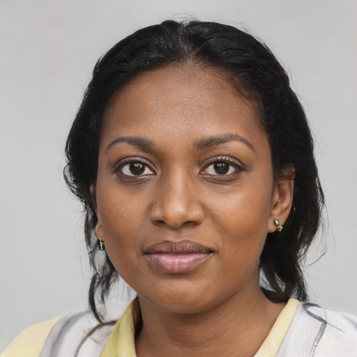 Joyful black young-adult female with medium  brown hair and brown eyes