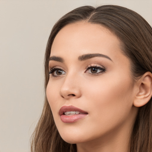 Neutral white young-adult female with long  brown hair and brown eyes